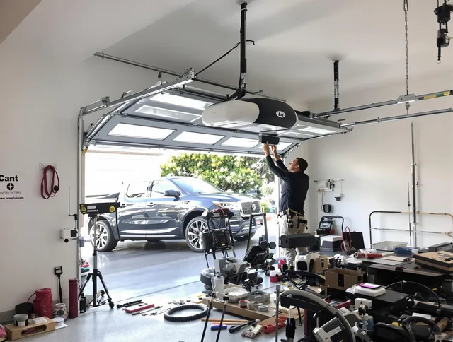 Castle Rock Garage Door Repair specialist installing smart garage door opener system in Castle Rock home