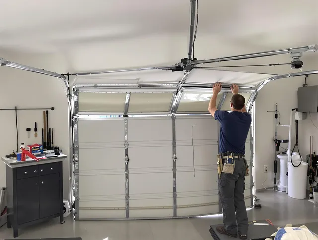 Castle Rock Garage Door Repair specialist performing precise section replacement on Castle Rock garage door